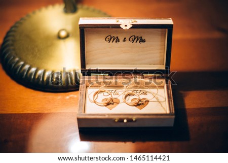 wedding gold rings in a box. wedding ceremony gathering bride and groom. on the table mr. and mrs. young family happy day. love and forever together
