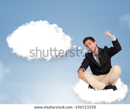 Handsome young man sitting on cloud and thinking of abstract speech bubble with copy space