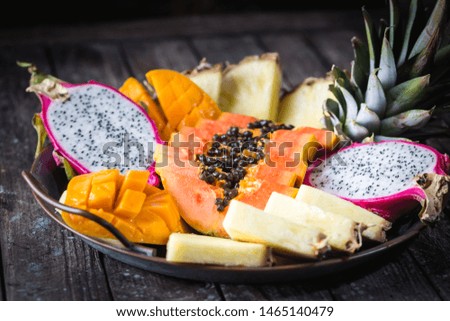 Assortment Set of Cutting Tropical Fruits. Papaya Pine Apple Mango Sapodilla Dragon on the tray