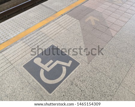 Disable Icon Sign or Wheelchair icon on foot path for Handicap person in Train Subway Station