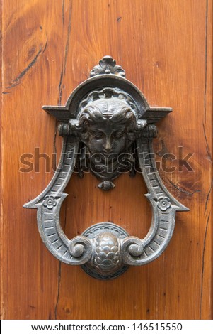 Door knocker in the form of a human face. Italy. Florence.