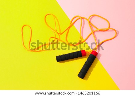 Jump rope on two tone background, space for text Royalty-Free Stock Photo #1465201166