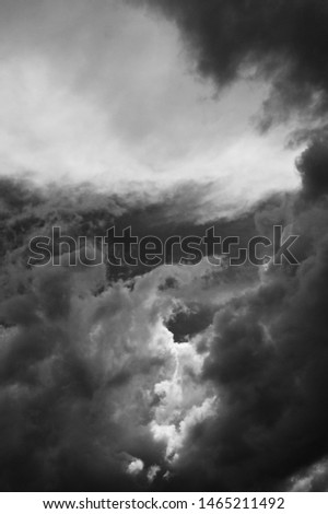 images above cloudsin the sky in black and white Royalty-Free Stock Photo #1465211492