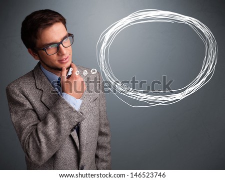 Good-looking young man thinking about speech or thought bubble with copy space