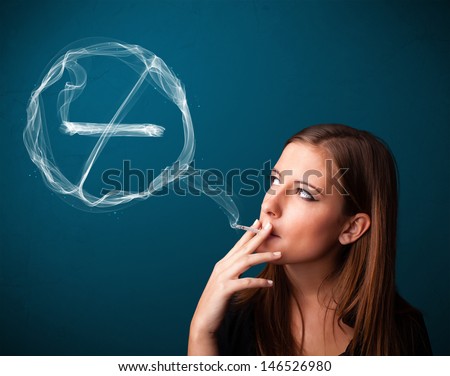 Pretty young lady smoking unheathy cigarette with no smoking sign