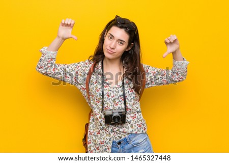 Young brunette traveler woman feels proud and self confident, example to follow.