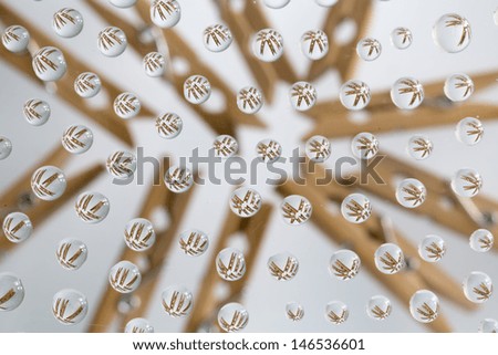 water drops picturing wooden pegs