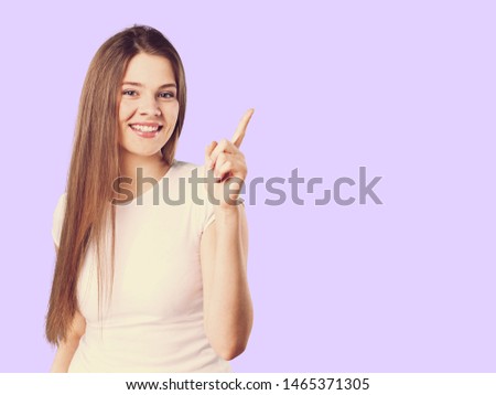 Korean woman point to special deals & discounts of promotions, tank top with beret hat, purple background