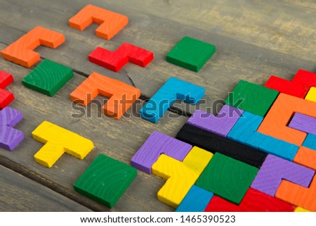Creative solution for idea - business concept, jigsaw puzzle on the wooden background Royalty-Free Stock Photo #1465390523