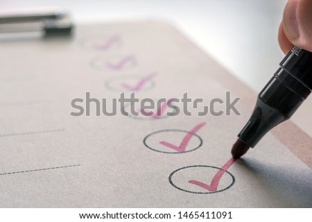 Completed tasks are ticked off on a to-do list Royalty-Free Stock Photo #1465411091