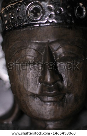 Wooden statue of Buda in a temple