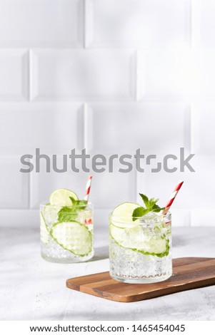 Refreshing cucumber cocktail with lime and mint