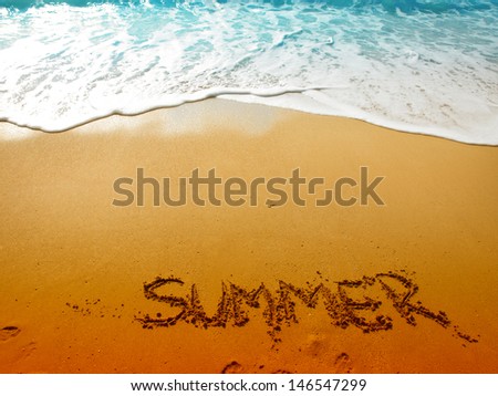 Inscription on wet sand Summer  Royalty-Free Stock Photo #146547299