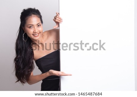 Young Asian woman present blank sign with palm hand on white background