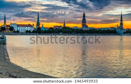 Historical district of Riga at dawn. Riga is the capital of Latvia, offers for tourists many resting opportunities with unique medieval buildings and churches  
 and unforgettable Gothic architecture