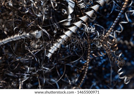 Close-up of twisted spiral steel shavings. Abstract background