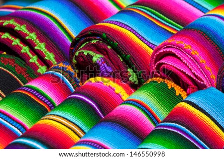Colorful Mexican blankets for sale at market, Latin America. Mexico travel background. Royalty-Free Stock Photo #146550998