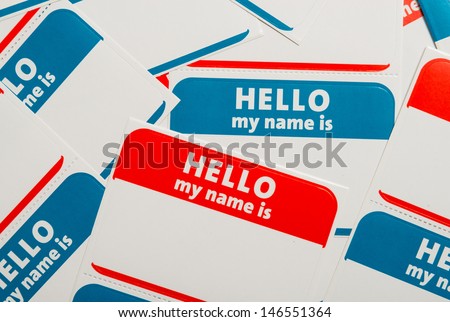 A stack of blue and red "Hello, my name is" name tags or badges Royalty-Free Stock Photo #146551364