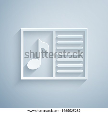 Paper cut Music book with note icon isolated on grey background. Music sheet with note stave. Notebook for musical notes. Paper art style. Vector Illustration