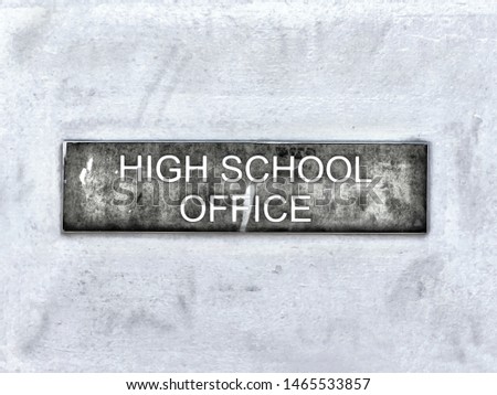 High School Office Sign hanging on a White Door. Entrance to the Reception. Vintage Style Photo.