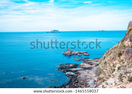 Rocks in the blue sea and blue sky at  Eo Gio cape, Binh Dinh province, Vietnam.