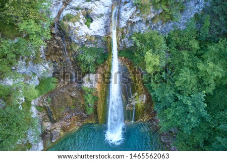 Aerial photography, waterfall in the mountains in the north of the Italian Alps. Trento, Italy.