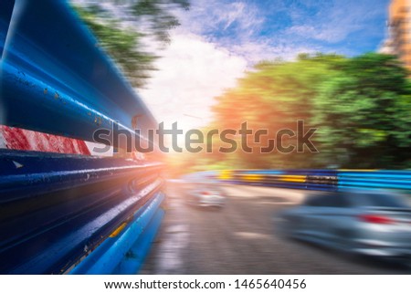 Racetrack on street highway with car motion blurred on track traffic in city capital. For automotive automobile or transport transportation image.