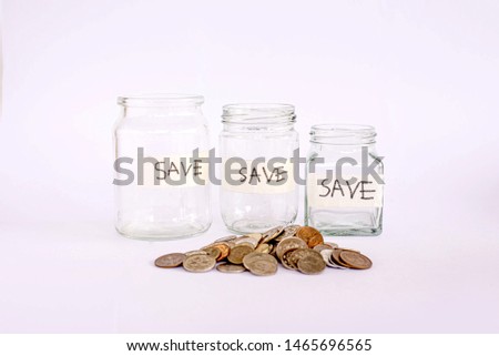 money and glass jar to saving concept
