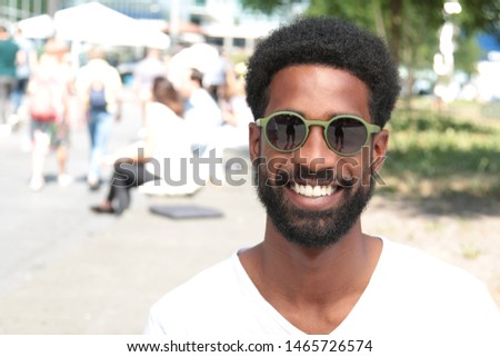 Beautiful happy black man outside