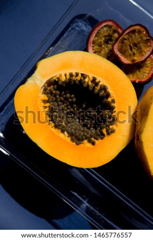 Fresh passion fruit isolated on a pastel pink background in top view. Ripe tropical passion fruit close up. Dessert of Vegetarian diet. intermittent fasting diet. Healthy snack.