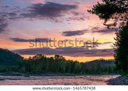 beautiful sky in the clouds and sunset over the river