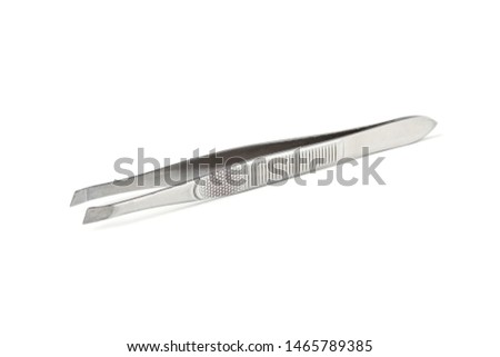 Metal tweezers close up isolated on white background