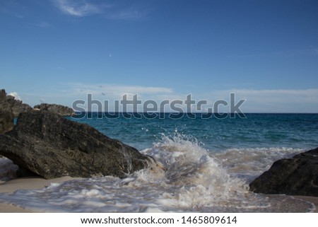 Waves Splashing The Big Rocks On Sandy Bermuda beach, Chaplin Bay On Sunny Day