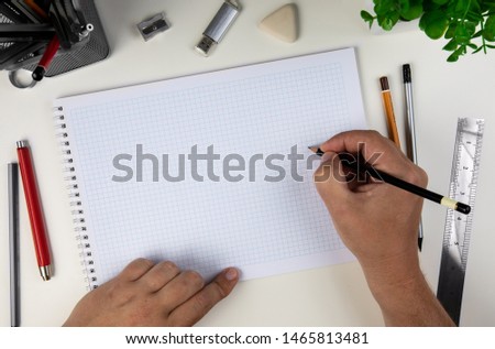 Human hand with pencil prepare to writing on notebook