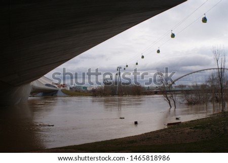 Ebro river flood from the shore, under the bridge pavilion, Zaragoza