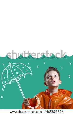 a boy in an orange raincoat and with a painted umbrella stands in the rain