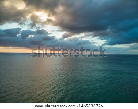 Aerial photographs of dawn flying over the ocean. Royalty-Free Stock Photo #1465838726