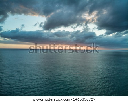 Aerial photographs of dawn flying over the ocean. Royalty-Free Stock Photo #1465838729