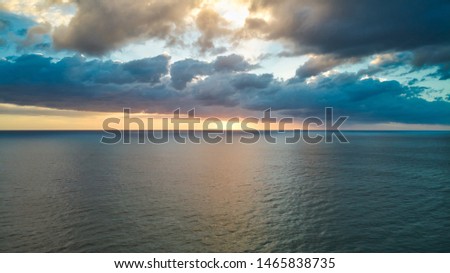 Aerial photographs of dawn flying over the ocean. Royalty-Free Stock Photo #1465838735