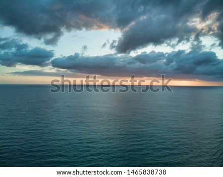 Aerial photographs of dawn flying over the ocean. Royalty-Free Stock Photo #1465838738