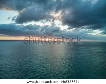 Aerial photographs of dawn flying over the ocean. Royalty-Free Stock Photo #1465838741