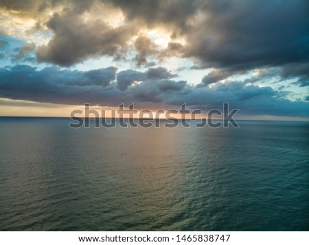 Aerial photographs of dawn flying over the ocean. Royalty-Free Stock Photo #1465838747