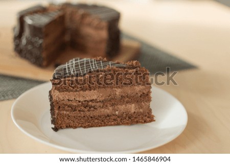 Chocolate cut cake top view. Sweet chocolate pie.