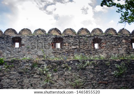 defensive walls and fortifications of a medieval castle.