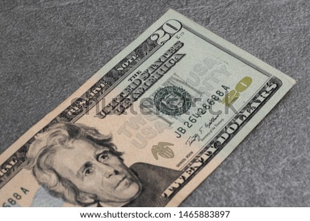 Close up of twenty dollar isolate on grey background. Horisontal photo