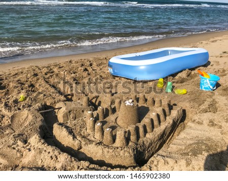
make sand castles by the sea and vacation