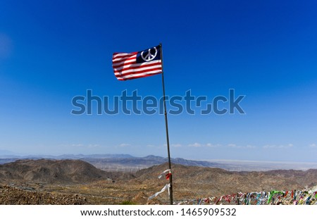 Picture of a American peace flag in the North Algodones Dunes, CA
