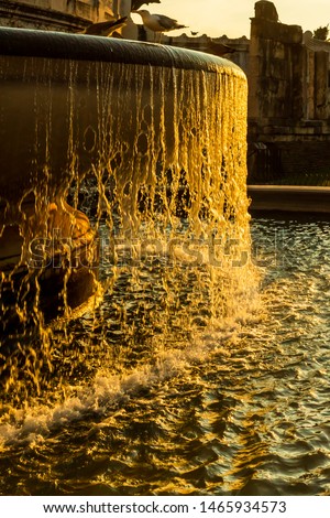 Stunning view of the Fontana dell'Adriatico in Rome with high shutter speed to freeze water drops in air during Golden Hour 