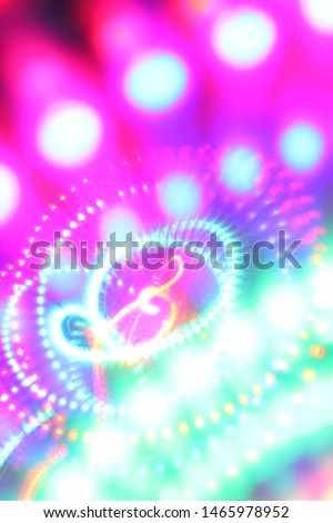 Led light blur abstract colorful rainbow background. Music symbol treble clef drawn using light in middle. Royalty-Free Stock Photo #1465978952