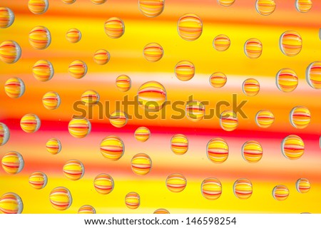 abstract picturing of water drops and their colorful reflections  
